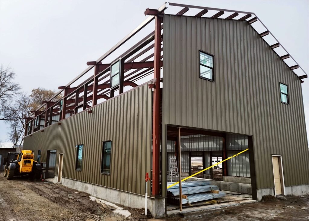 Steel home construction with exposed framing and metal siding in Cache Valley Utah